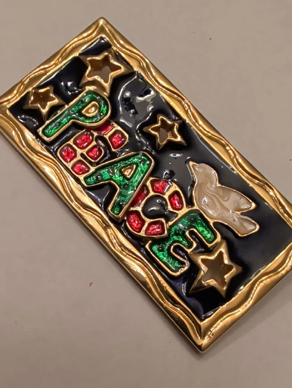 Gold-Trim 'PEACE' Brooch with Green and Red Accents